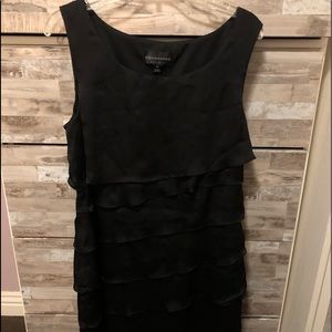 Black sleeveless dress.